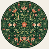 Covaba boho birdsong floral garden round rug in fern green, shown flat on a plain ivory backdrop