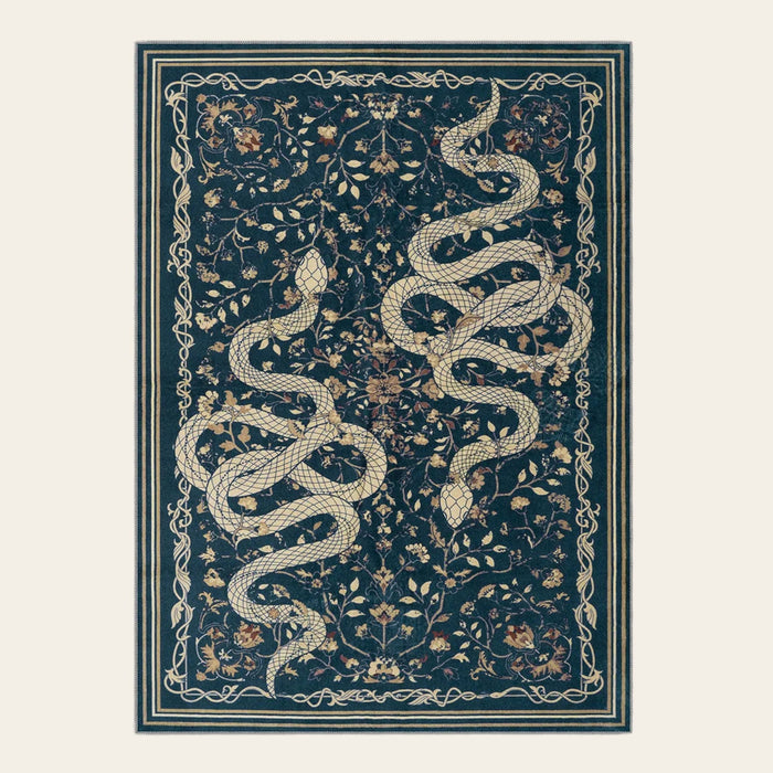 Covaba mystical snake area rug in stormy blue, shown flat on a plain ivory backdrop