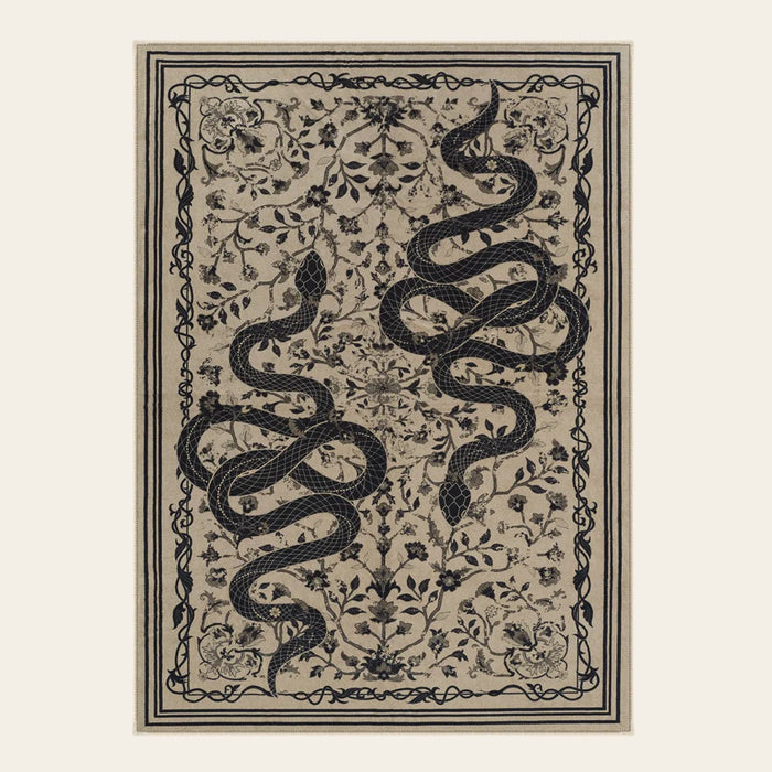 Covaba mystical snake area rug in coffee brown, shown flat on a plain ivory backdrop