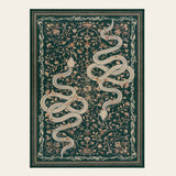 Covaba mystical snake area rug in fern green, shown flat on a plain ivory backdrop