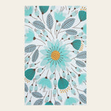 Covaba floral indoor outdoor area rug in stormy blue, shown flat on a plain ivory backdrop