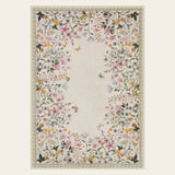 Covaba modern blooming floral garden doormat in warm beige, shown flat on a plain ivory backdrop