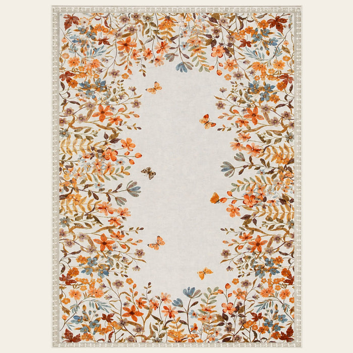 Covaba modern blooming floral garden area rug in golden wheat, shown flat on a plain ivory backdrop