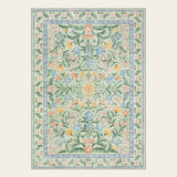 Covaba boho modern parisian garden floral area rug in fern green, shown flat on a plain ivory backdrop