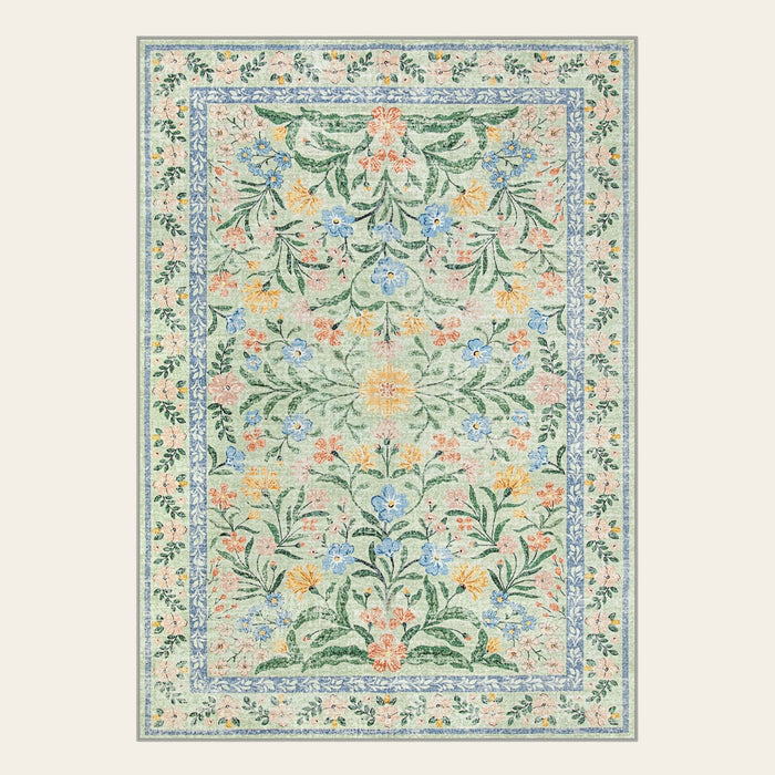 Covaba boho modern parisian garden floral area rug in fern green, shown flat on a plain ivory backdrop