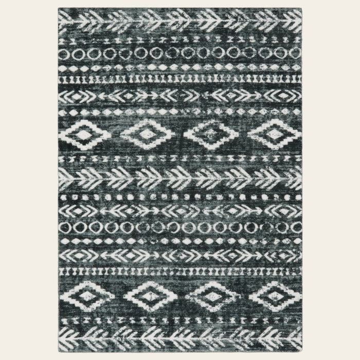 Covaba modern rustic farmhouse moroccan tribal black/white area rug in soft white, shown flat on a plain ivory backdrop