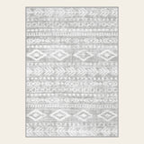 Covaba modern rustic farmhouse moroccan tribal grey/white area rug in soft white, shown flat on a plain ivory backdrop