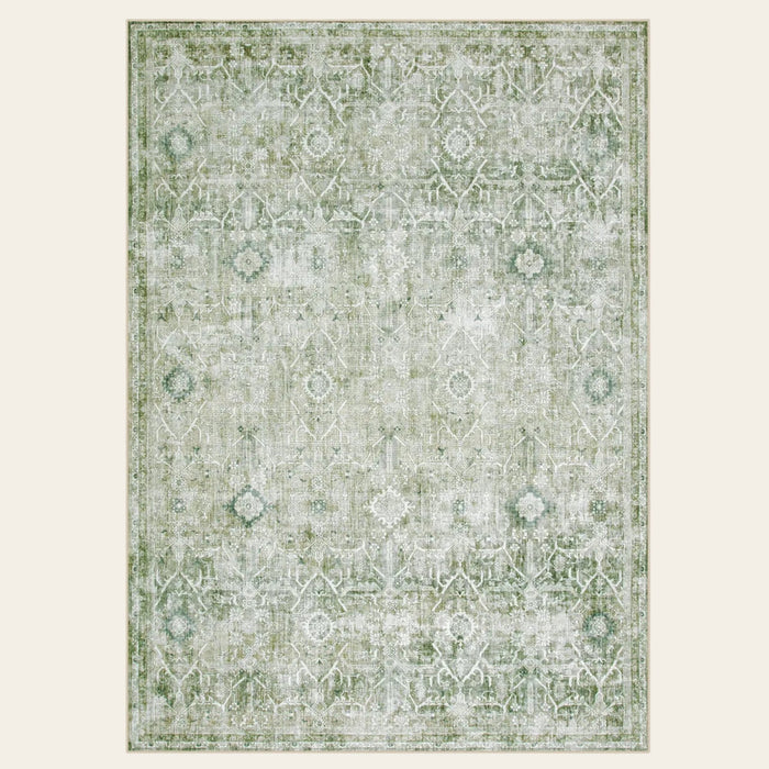 Covaba vintage area rug in fern green, shown flat on a plain ivory backdrop