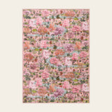 Covaba forest woodland area rug in blush clay, shown flat on a plain ivory backdrop