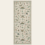 Covaba modern parisian insect runner rug in warm beige, shown flat on a plain ivory backdrop