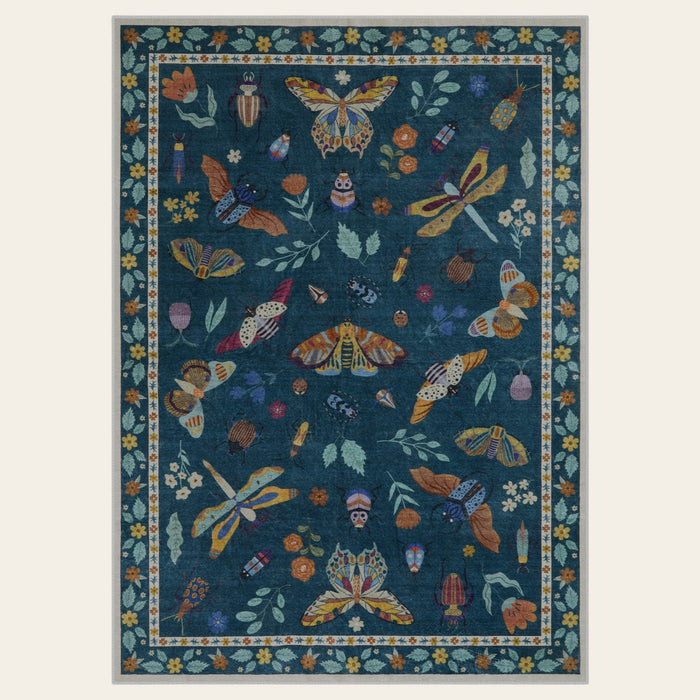 Covaba modern parisian insect area rug in fern green, shown flat on a plain ivory backdrop