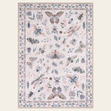 Covaba modern parisian insect area rug in soft blush, shown flat on a plain ivory backdrop