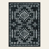 Covaba aztec moroccan distressed area rug in ink black, shown flat on a plain ivory backdrop