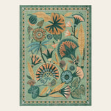 Covaba egyptian-inspired botanical area rug in fern green, shown flat on a plain ivory backdrop
