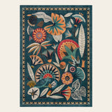 Covaba egyptian-inspired botanical area rug in teal haze, shown flat on a plain ivory backdrop