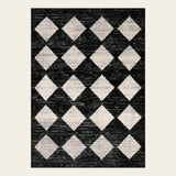 Covaba modern geometric diamond checkered doormat in ink black, shown flat on a plain ivory backdrop