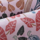 Covaba maximalism vibrant blossom floral rug in blush clay, styled in a room setting