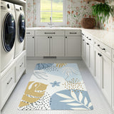Covaba modern botanical leaf area rug in stormy blue, styled in a room setting, view 12