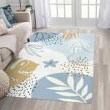 Covaba modern botanical leaf area rug in stormy blue, styled in a room setting, view 13