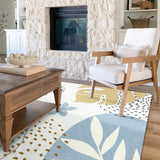 Covaba modern botanical leaf area rug in stormy blue, styled in a room setting, view 15
