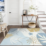 Covaba modern botanical leaf area rug in stormy blue, styled in a room setting, view 16