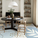 Covaba modern botanical leaf area rug in stormy blue, styled in a room setting, view 4