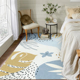 Covaba modern botanical leaf area rug in stormy blue, styled in a room setting, view 10
