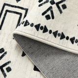 Covaba aztec moroccan distressed rug in warm beige, styled in a room setting