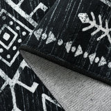 Covaba aztec moroccan distressed rug in ink black, styled in a room setting