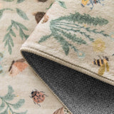 Covaba boho insect botanical floral rug in warm beige, styled in a room setting