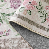 Covaba boho modern parisian garden floral rug in muted plum, styled in a room setting, view 2