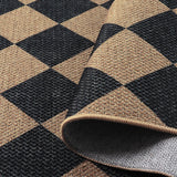 Covaba geometric checkered easy jute indoor/outdoor rug in ink black, styled in a room setting, view 2