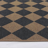 Covaba geometric checkered easy jute indoor/outdoor rug in stormy blue, styled in a room setting, view 2