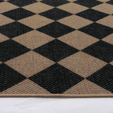 Covaba geometric checkered easy jute indoor/outdoor rug in coffee brown, styled in a room setting