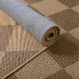 Covaba geometric checkered easy jute indoor/outdoor rug in dune khaki, styled in a room setting, view 2