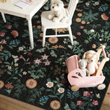 Covaba boho botanical floral rug in ink black, styled in a room setting, view 2