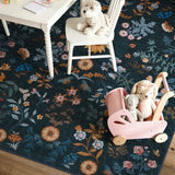 Covaba boho botanical floral rug in stormy blue, styled in a room setting, view 2