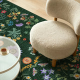 Covaba boho botanical floral rug in fern green, styled in a room setting