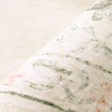 Covaba vintage traditional floral rug in warm beige, styled in a room setting