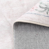 Covaba vintage traditional floral rug in blush clay, styled in a room setting, view 3