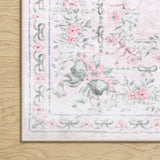 Covaba vintage traditional floral rug in blush clay, styled in a room setting, view 2