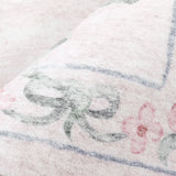 Covaba vintage traditional floral rug in blush clay, styled in a room setting, view 4