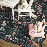 Covaba maximalist unicorn garden scalloped area rug in ink black, styled in a room setting, view 10