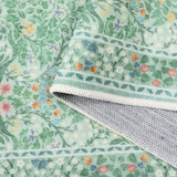 Covaba maximalism vintage french floral rug in willow sage, styled in a room setting