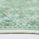 Covaba maximalism vintage french floral rug in willow sage, styled in a room setting, view 2
