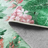 Covaba jungle botanical spring rug in fern green, styled in a room setting