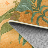 Covaba jungle fall sunrise rug in amber clay, styled in a room setting
