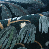 Covaba jungle midnight rug in stormy blue, styled in a room setting, view 2