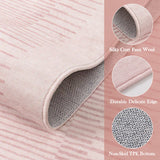 Covaba modern minimalist line rug in blush clay, styled in a room setting, view 2