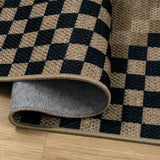 Covaba tribal soft easy jute indoor/outdoor rug in ink black, styled in a room setting, view 2